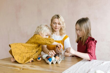 a mother and two kids with their Easter finds